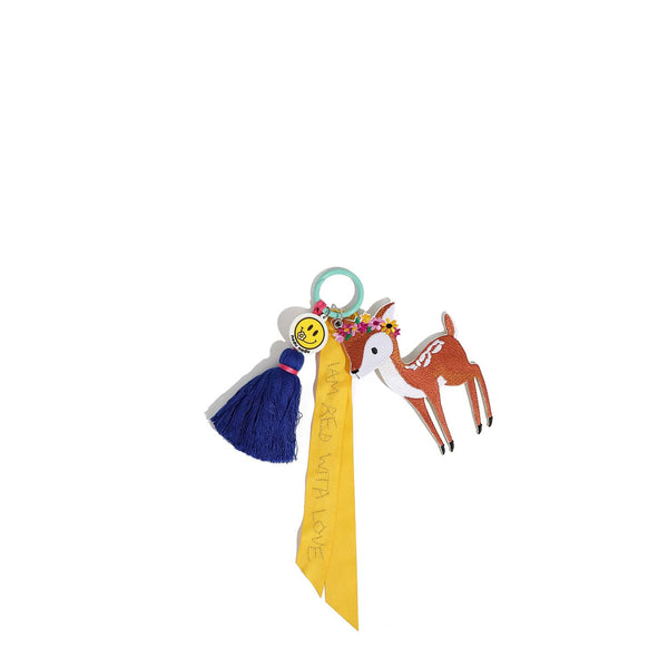 Nodu Nadu NN2065 deer keychain bag charm with navy tassel, smiley charm, and yellow ribbon reading “I’M MAD WITH LOVE”.